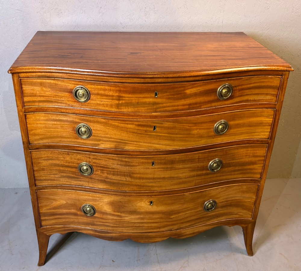 A Georgian serpentine chest of drawers in mahogany