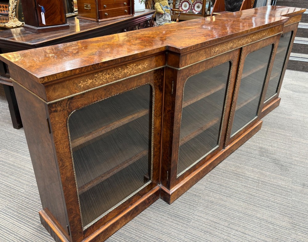 A  Victorian burr walnut and marquetry inlaid low long bookcase View II