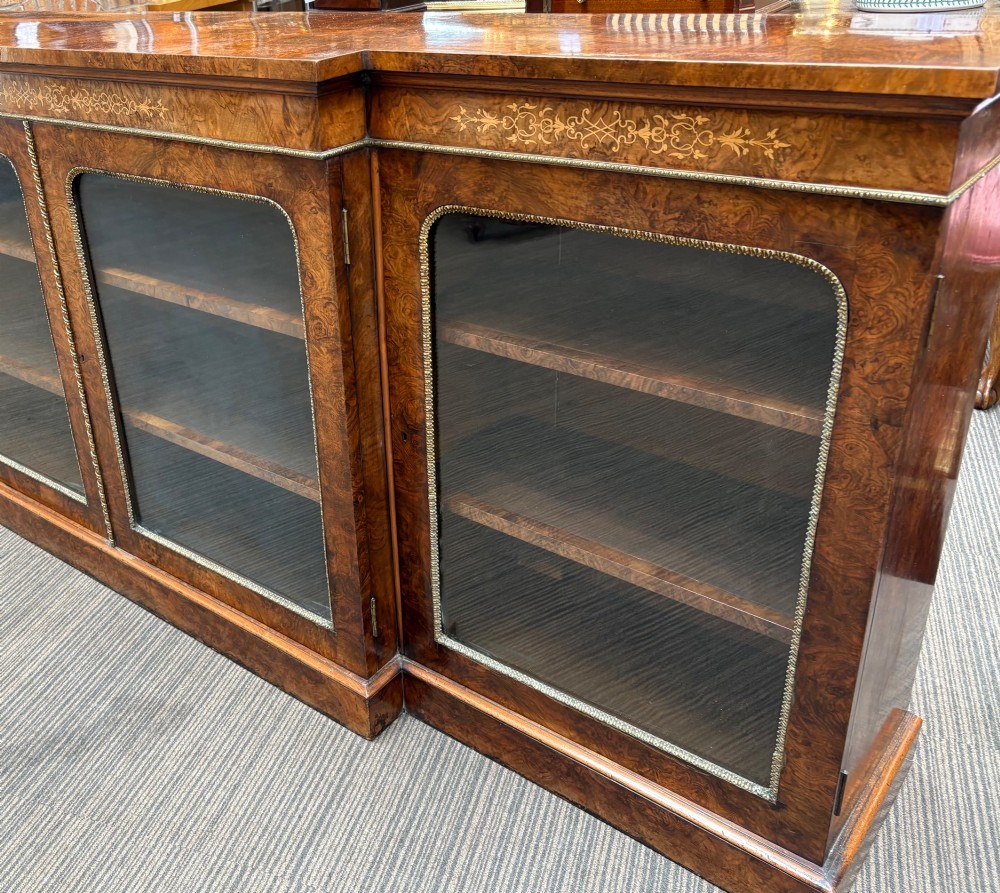A  Victorian burr walnut and marquetry inlaid low long bookcase View IV