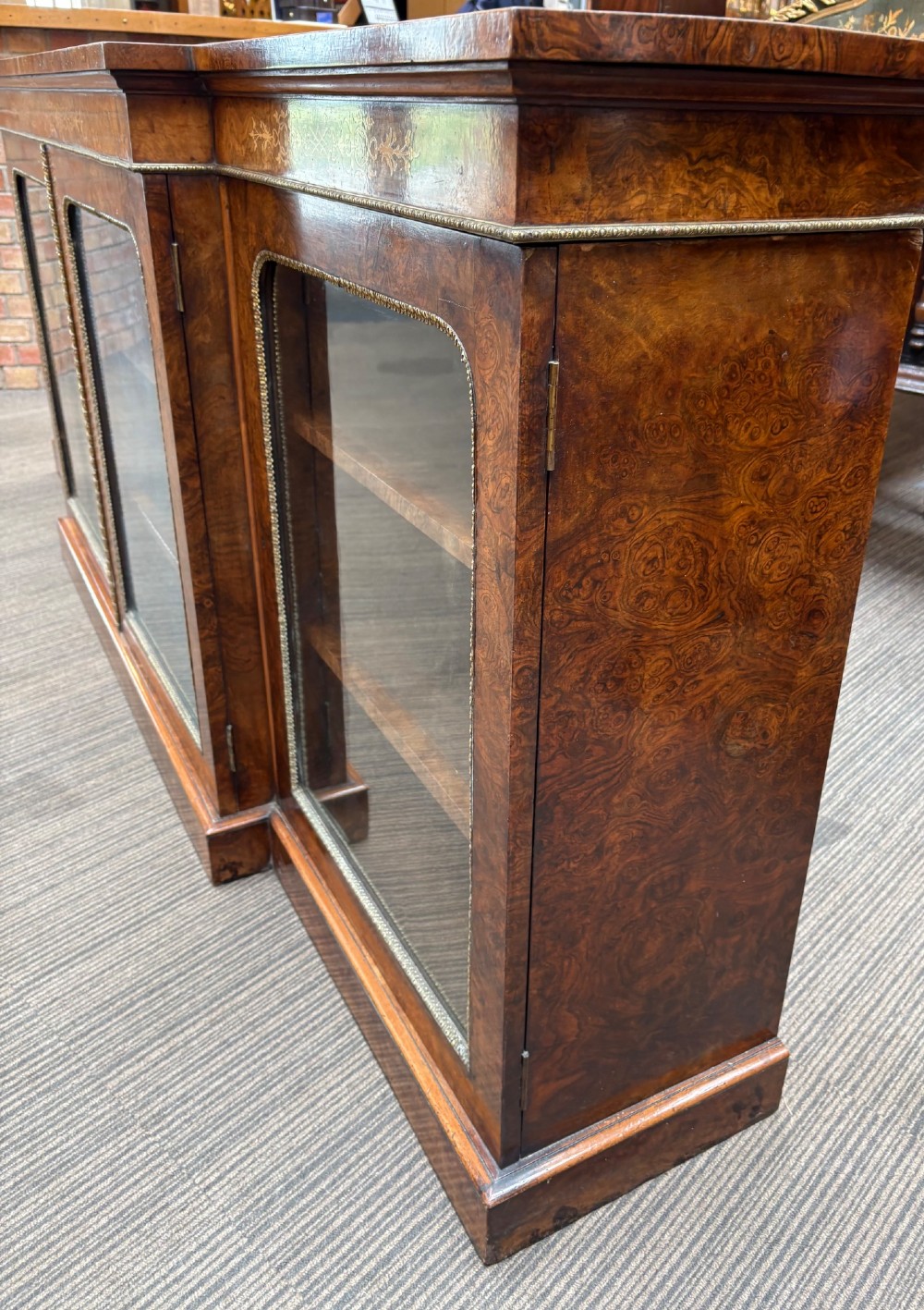 A  Victorian burr walnut and marquetry inlaid low long bookcase View VI
