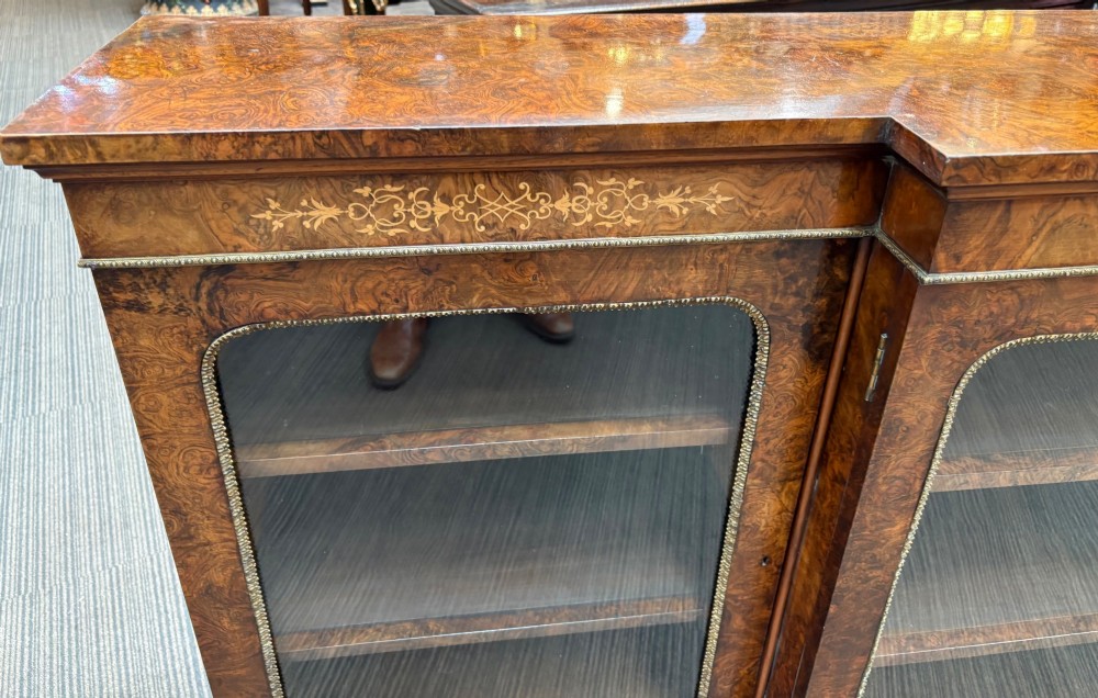 A  Victorian burr walnut and marquetry inlaid low long bookcase View VIII
