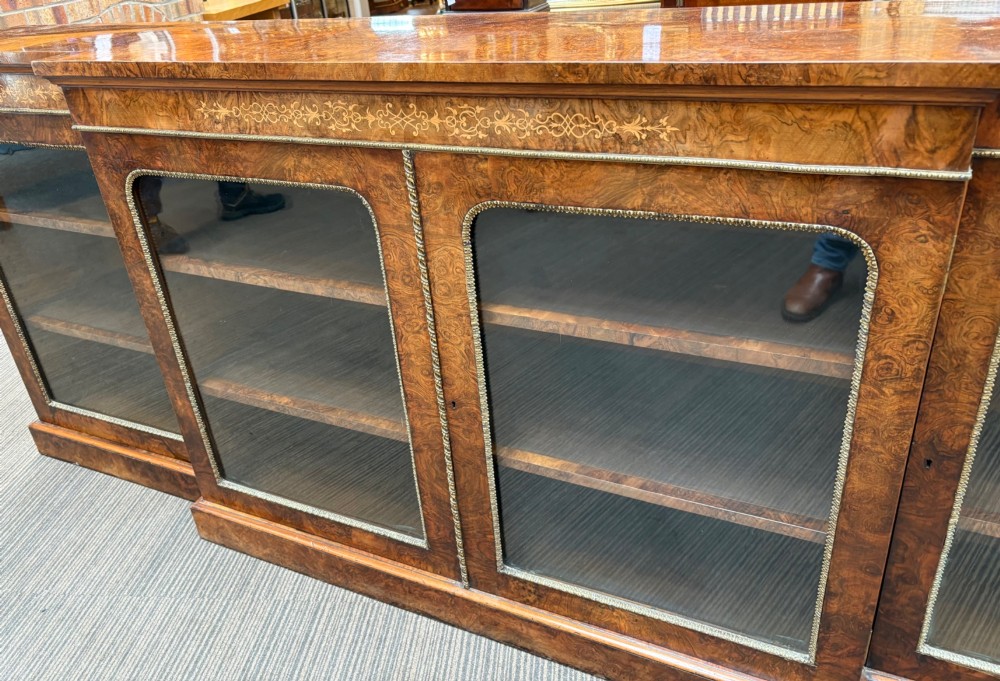 A  Victorian burr walnut and marquetry inlaid low long bookcase View X