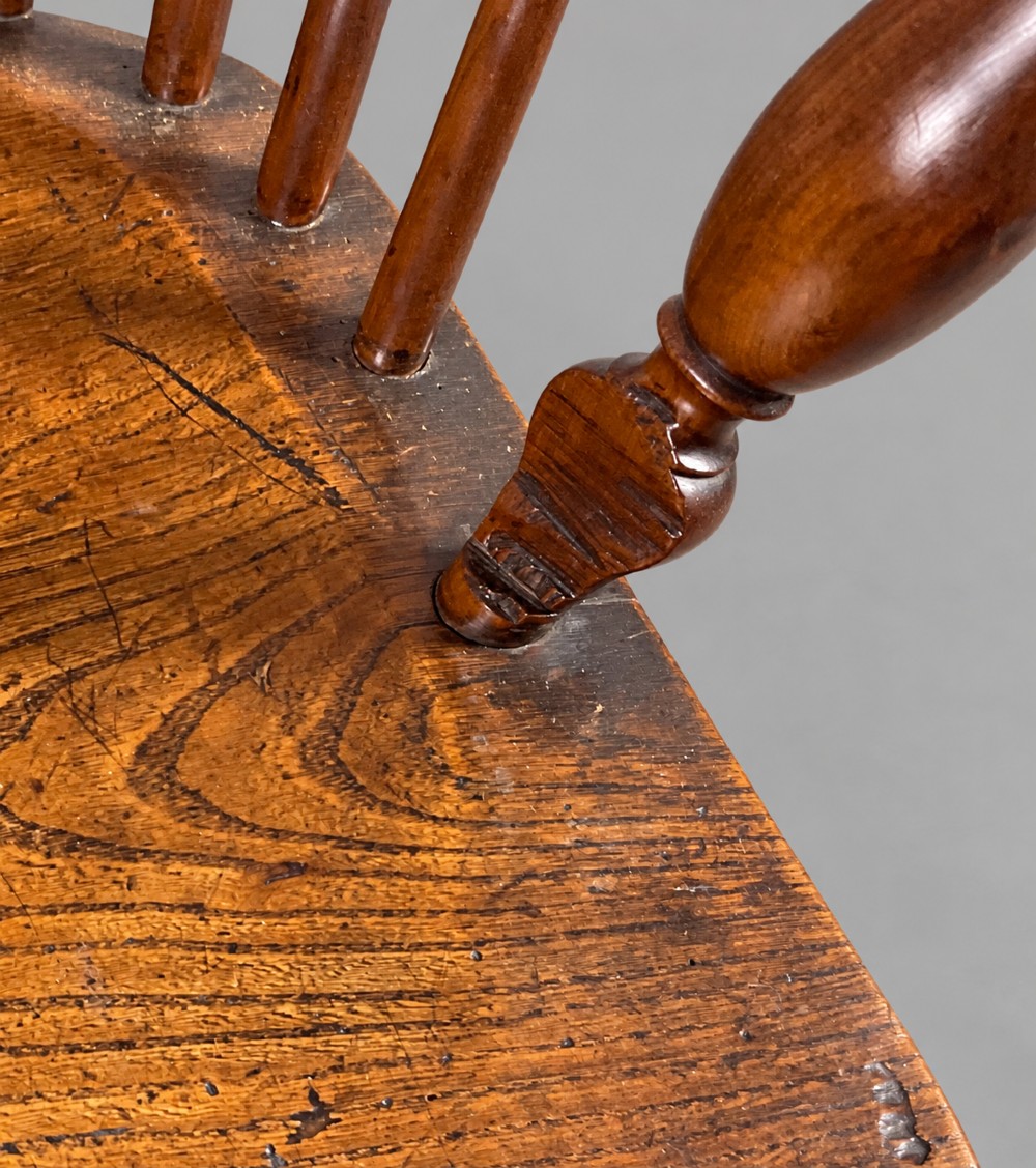 A low back antique yew wood Windsor chair featuring a contoured seat, turned legs, a crinoline stretcher, and a pierced decorative splat. View IX