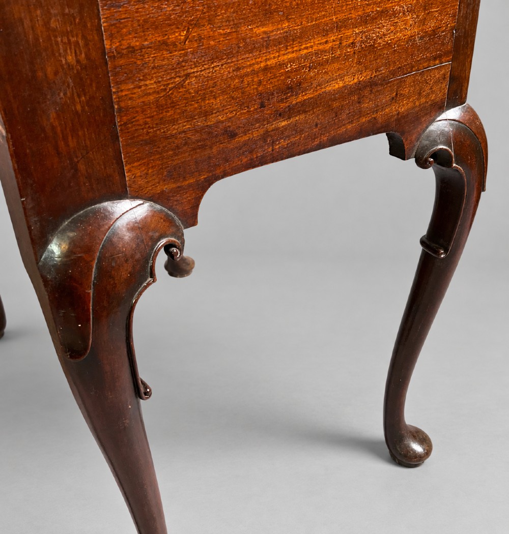 An 18th-century mahogany lowboy featuring three brass-handled drawers, a shaped apron, and four cabriole legs ending in pad feet. View VII