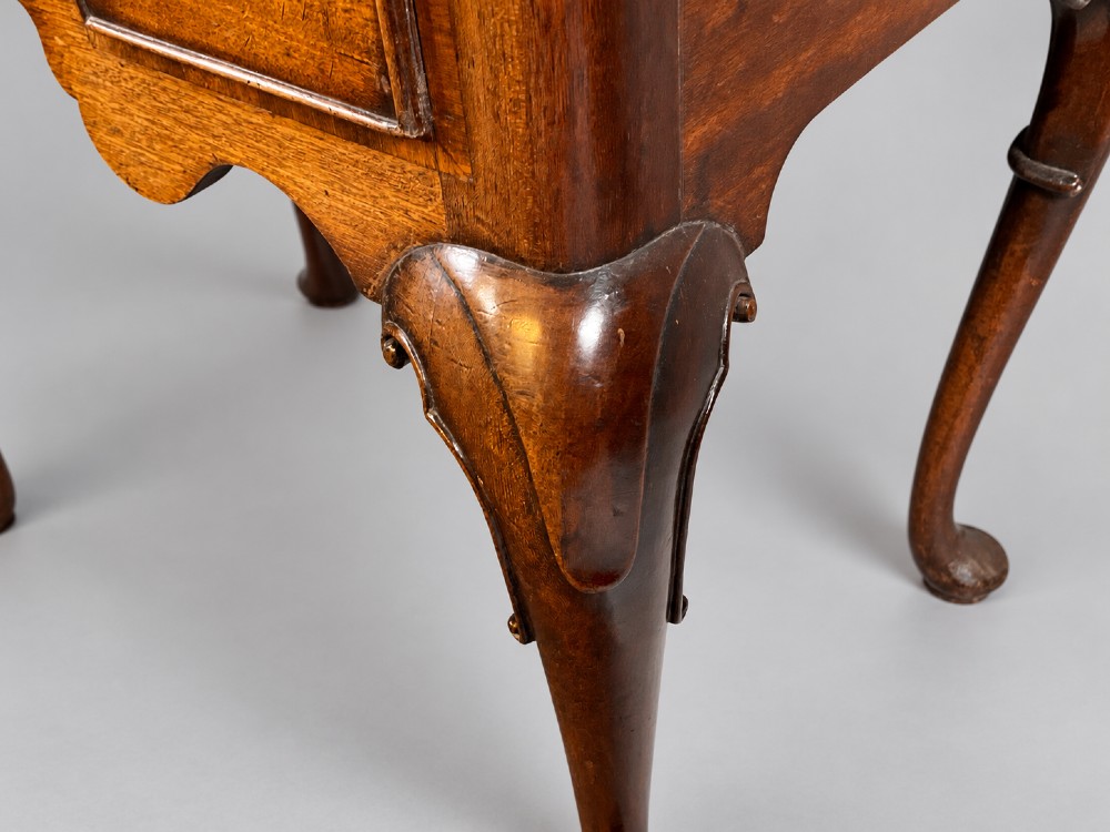 An 18th-century mahogany lowboy featuring three brass-handled drawers, a shaped apron, and four cabriole legs ending in pad feet. View XIII