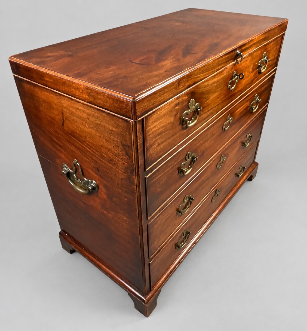 An 18th-century mahogany campaign dressing chest featuring graduated drawers with brass bail handles, side carrying loops, and bracket feet. View VII