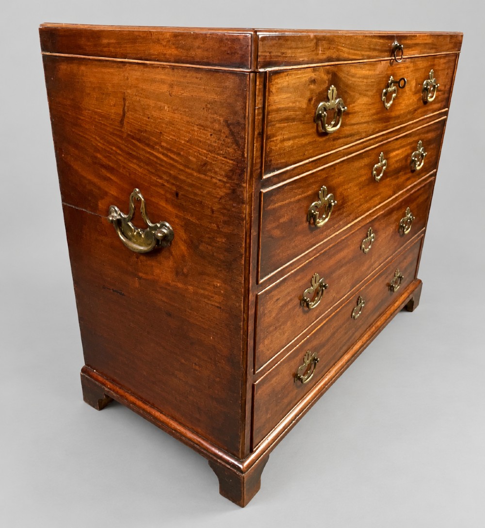 An 18th-century mahogany campaign dressing chest featuring graduated drawers with brass bail handles, side carrying loops, and bracket feet. View IX