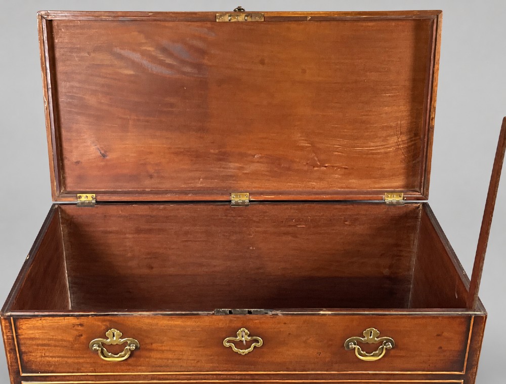 An 18th-century mahogany campaign dressing chest featuring graduated drawers with brass bail handles, side carrying loops, and bracket feet. View XI