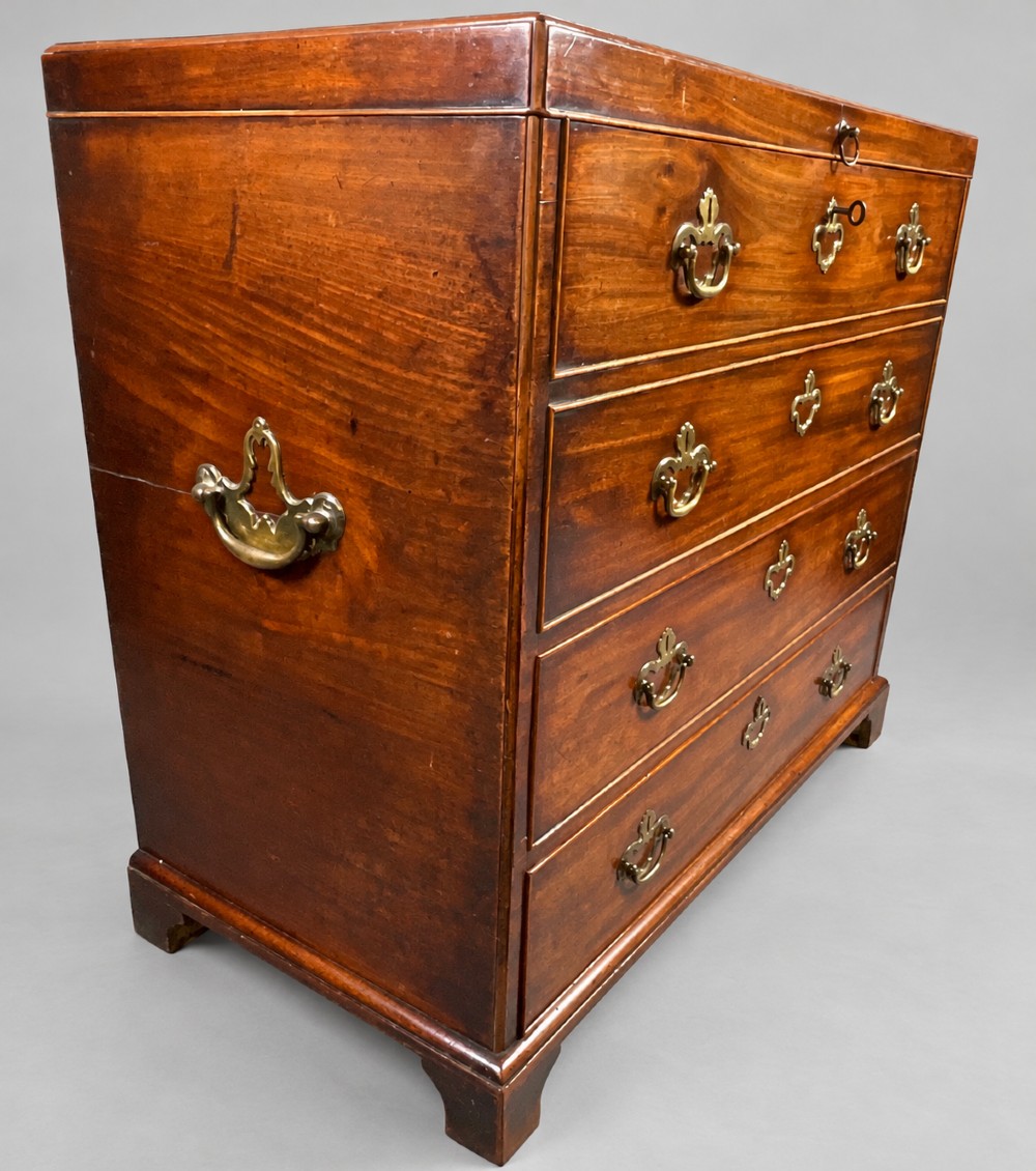 An 18th-century mahogany campaign dressing chest featuring graduated drawers with brass bail handles, side carrying loops, and bracket feet. View XII