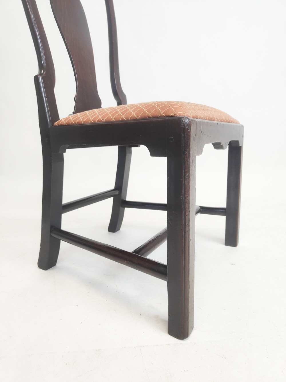 An eighteenth-century dark mahogany side chair featuring a vasiform splat back and a geometric patterned drop-in seat. View IV