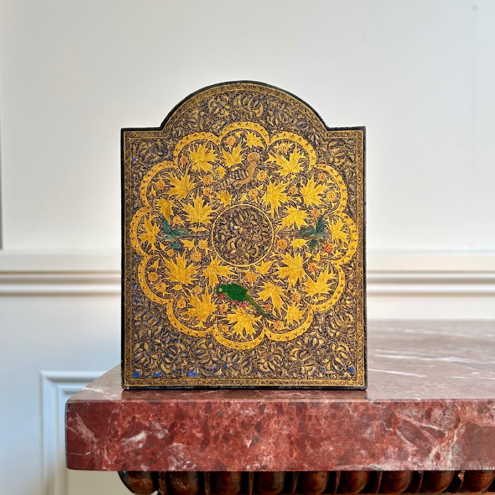 A pair of arched Kashmiri bookends decorated with intricate gold floral patterns, chinar leaves, and colourful painted birds on a dark background. View III