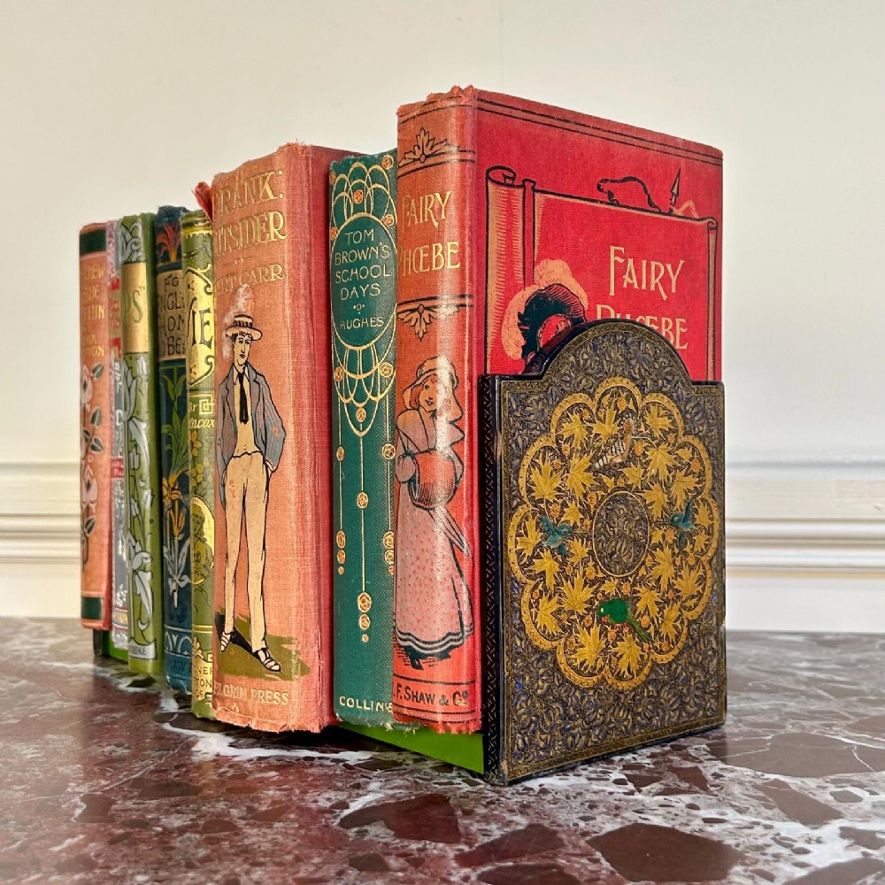 A pair of arched Kashmiri bookends decorated with intricate gold floral patterns, chinar leaves, and colourful painted birds on a dark background. View IV