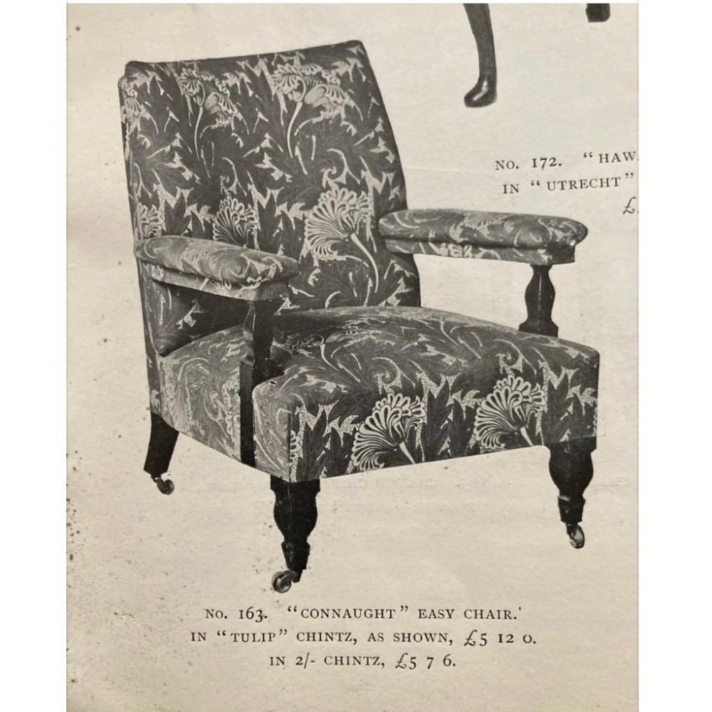 A nineteenth-century Arts and Crafts armchair featuring pink floral fabric upholstery, turned mahogany front legs, and brass castors. View VIII