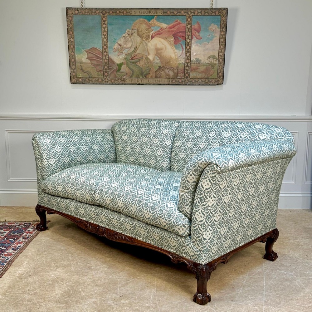A two-seater upholstered sofa featuring sage green and cream patterned fabric with carved mahogany cabriole front legs. View II