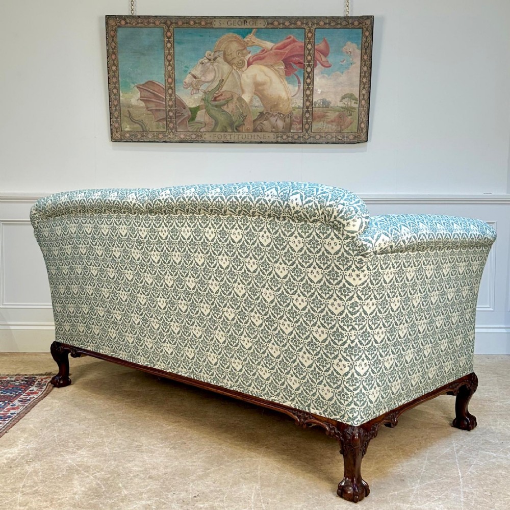 A two-seater upholstered sofa featuring sage green and cream patterned fabric with carved mahogany cabriole front legs. View VIII