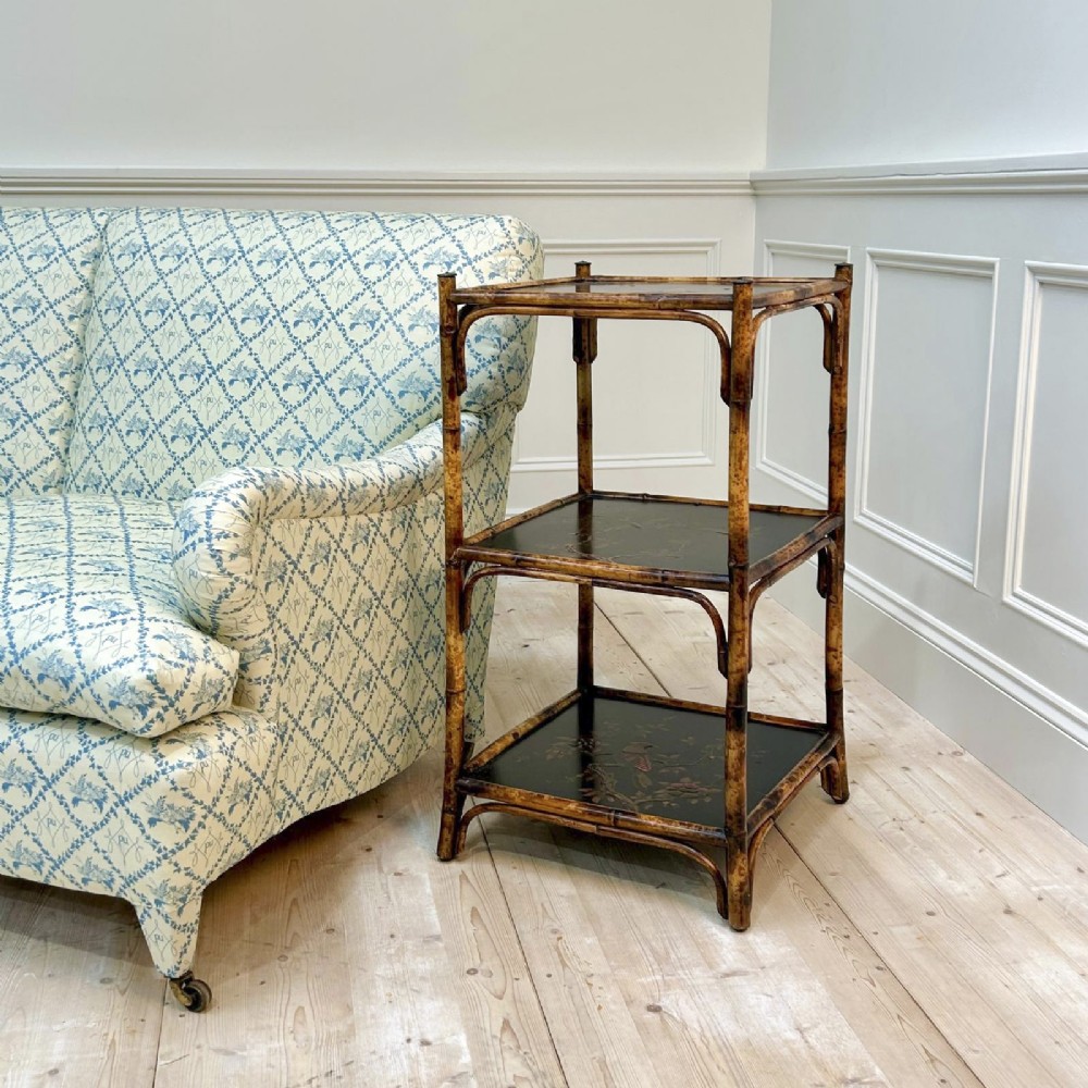A three-tiered bamboo etagere featuring dark lacquered square shelf panels painted with bird and botanical designs. View II