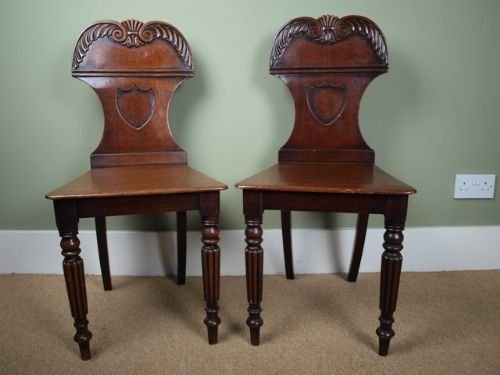 A Pair of Regency Mahogany Hall Chairs