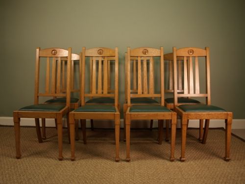 A Set of 8 Stylish Oak Dining Chairs