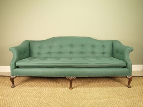 An Impressive Large Upholstered Camel Back Sofa