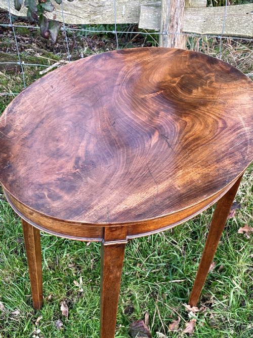 A LATE GEORGE III FLAME MAHOGANY OVAL OCCASIONAL TABLE - ADDITIONAL PHOTO 1