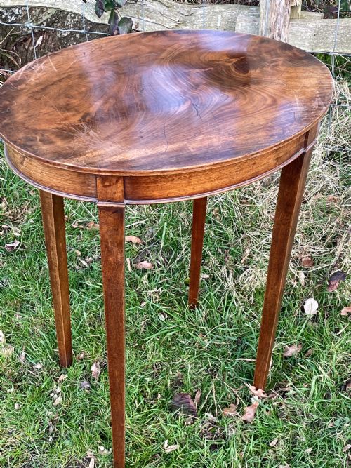 A LATE GEORGE III FLAME MAHOGANY OVAL OCCASIONAL TABLE - ADDITIONAL PHOTO 2