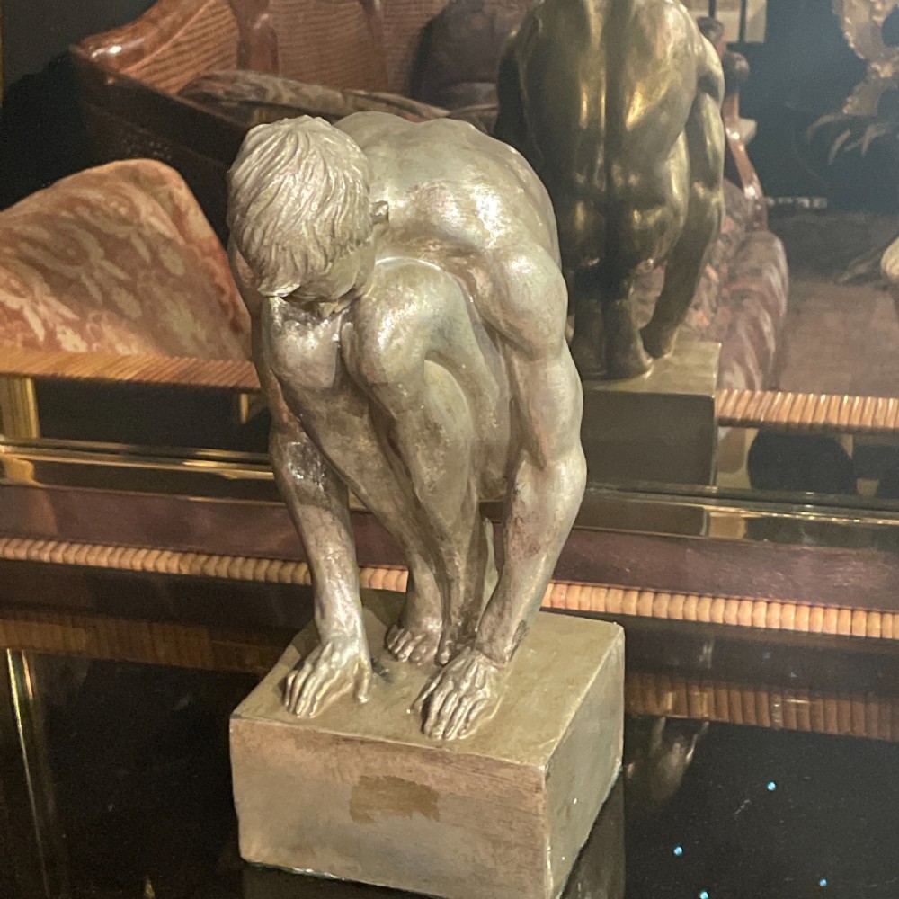 An Art Deco silvered figure of a crouching male nude View III