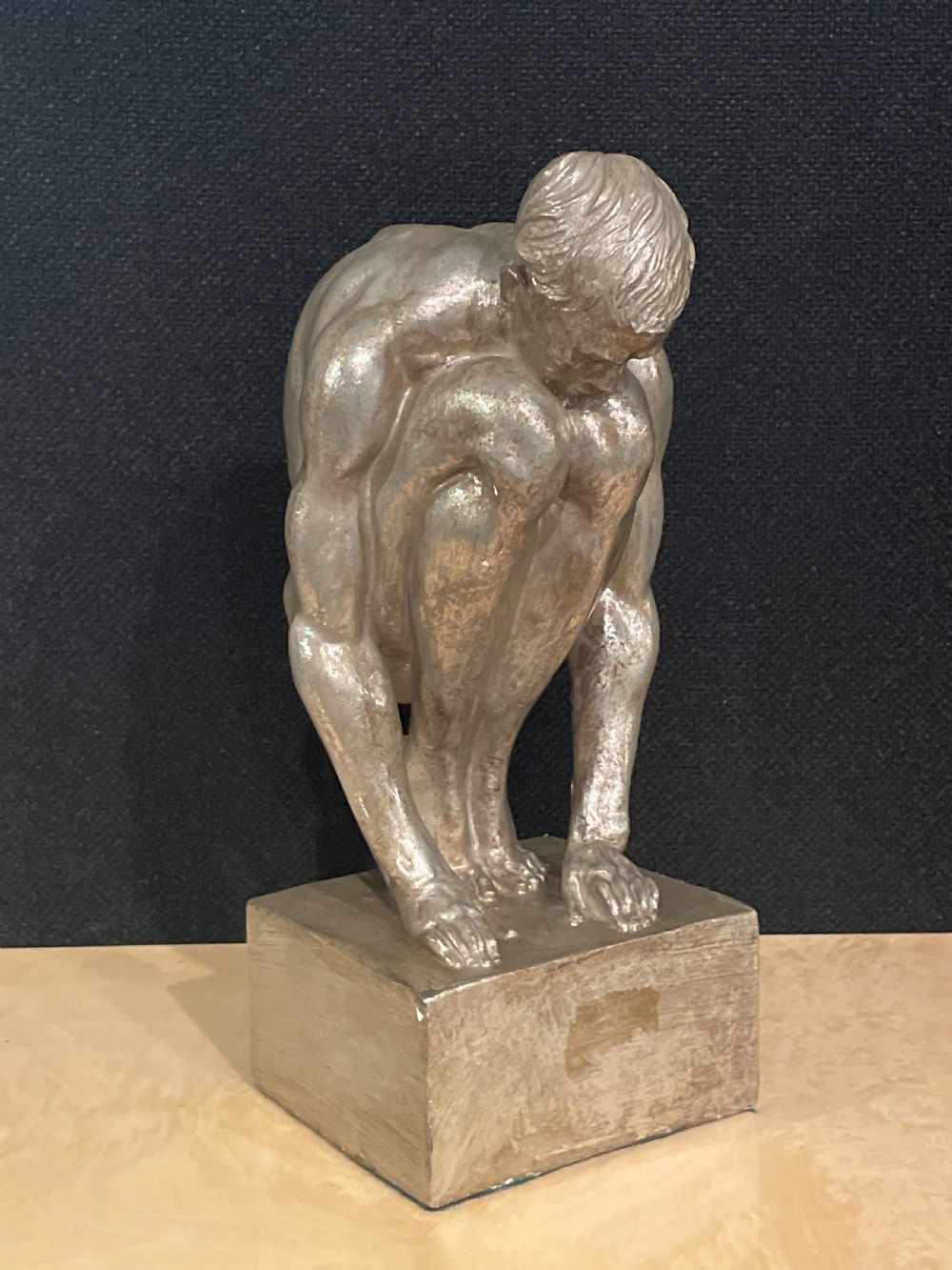 An Art Deco silvered figure of a crouching male nude View IV