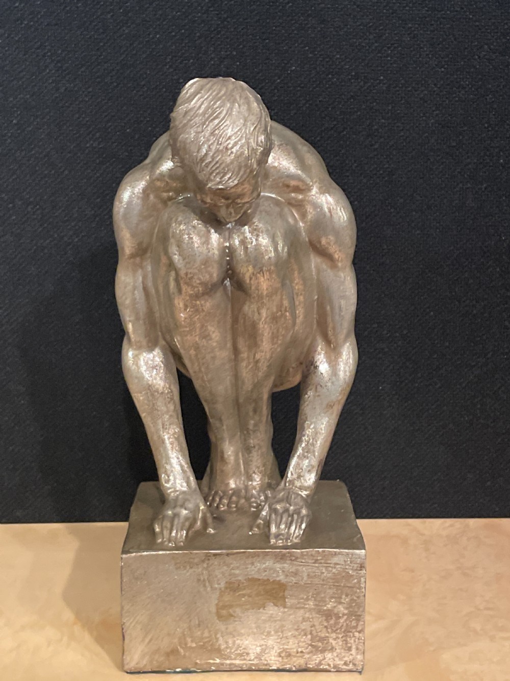 An Art Deco silvered figure of a crouching male nude View V