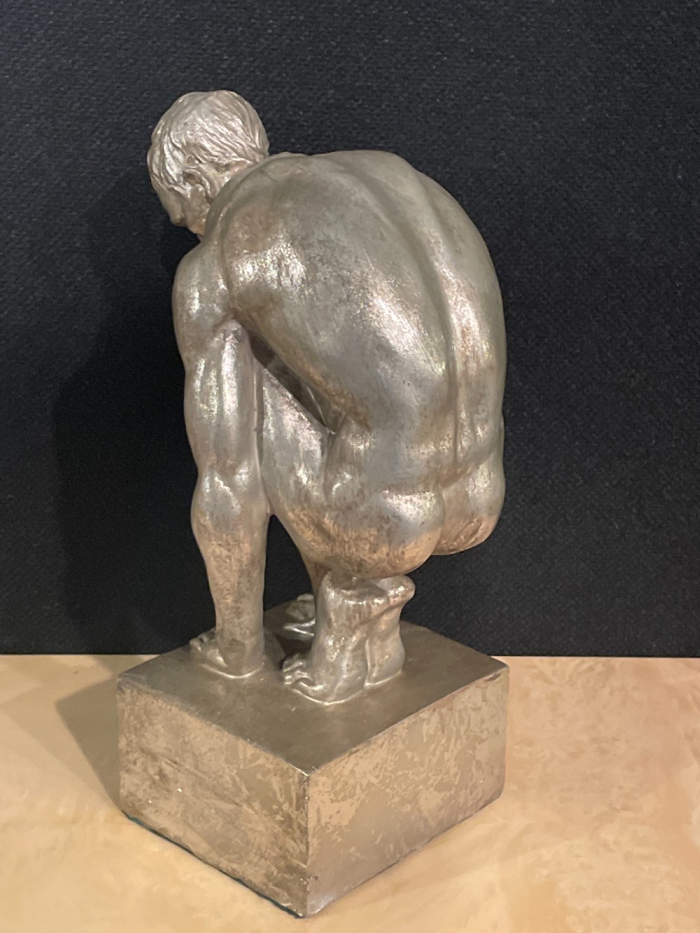 An Art Deco silvered figure of a crouching male nude View VI