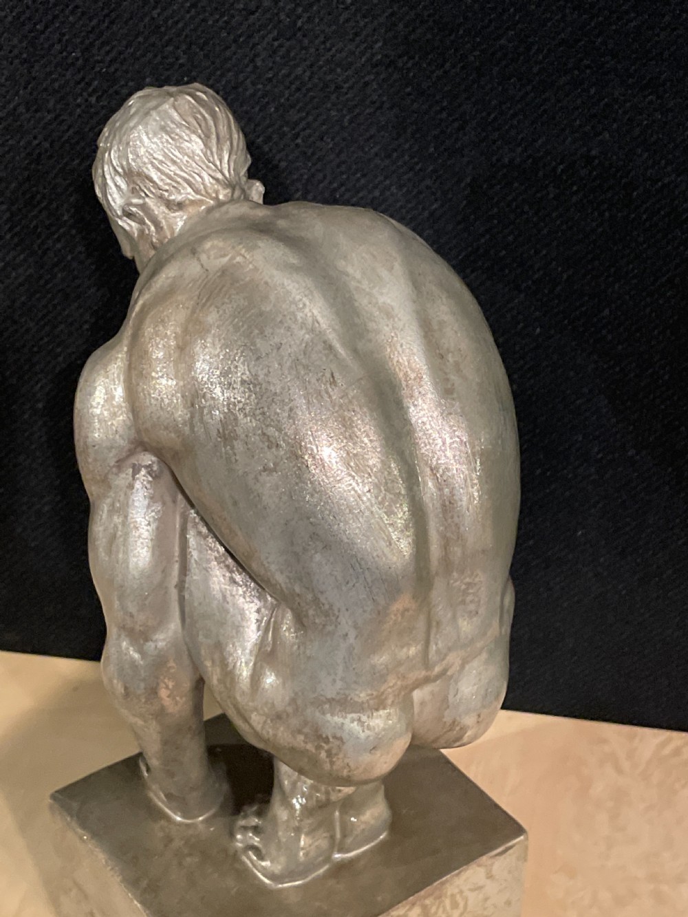 An Art Deco silvered figure of a crouching male nude View VII