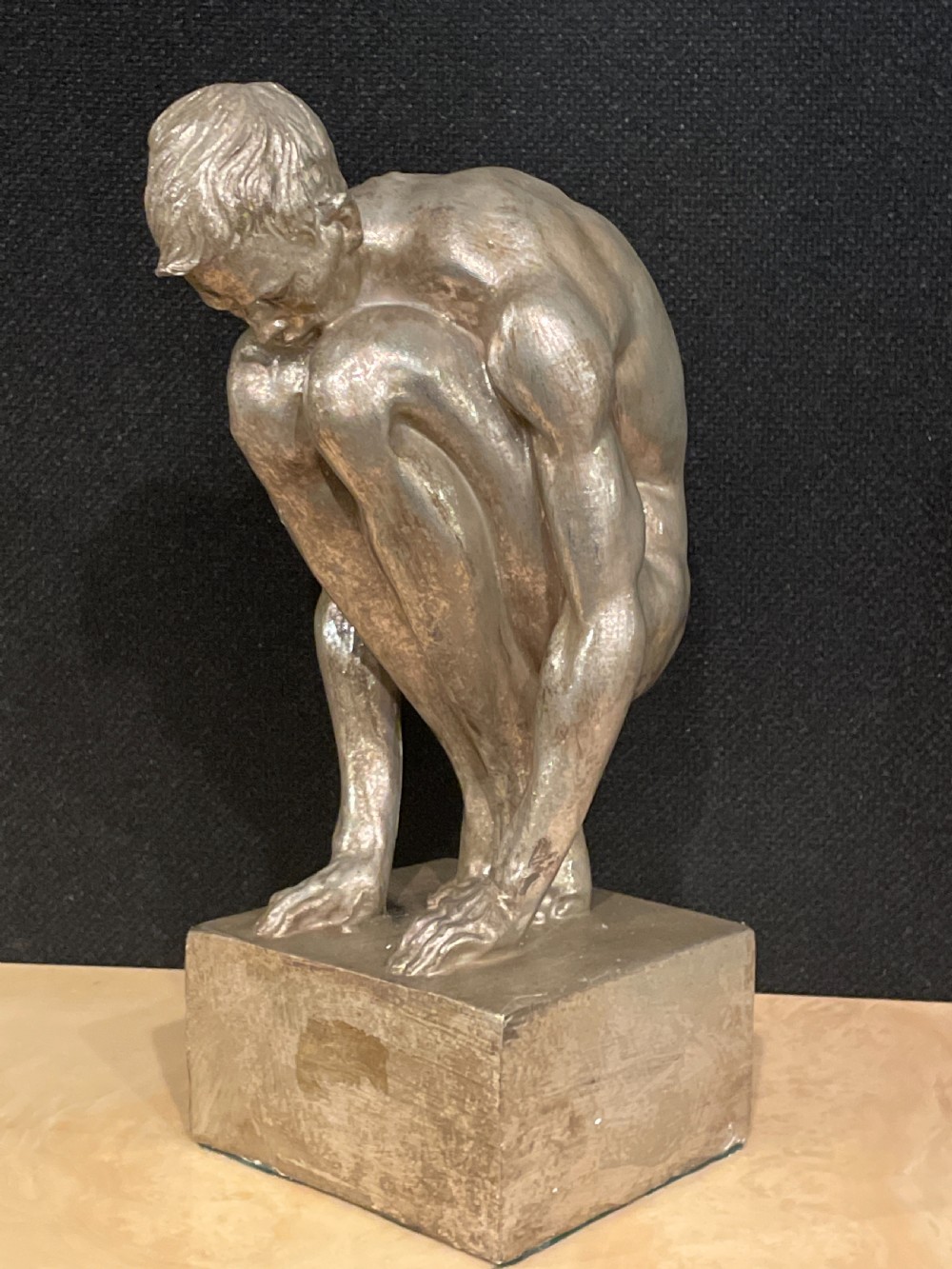An Art Deco silvered figure of a crouching male nude View XII