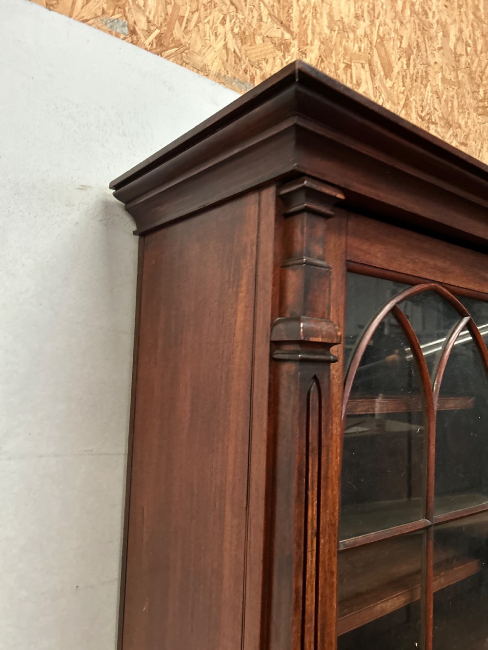 A dark George IV rosewood two-tier bookcase featuring upper glazed doors with Gothic lancet arches and lower panelled doors with tracery. View VII