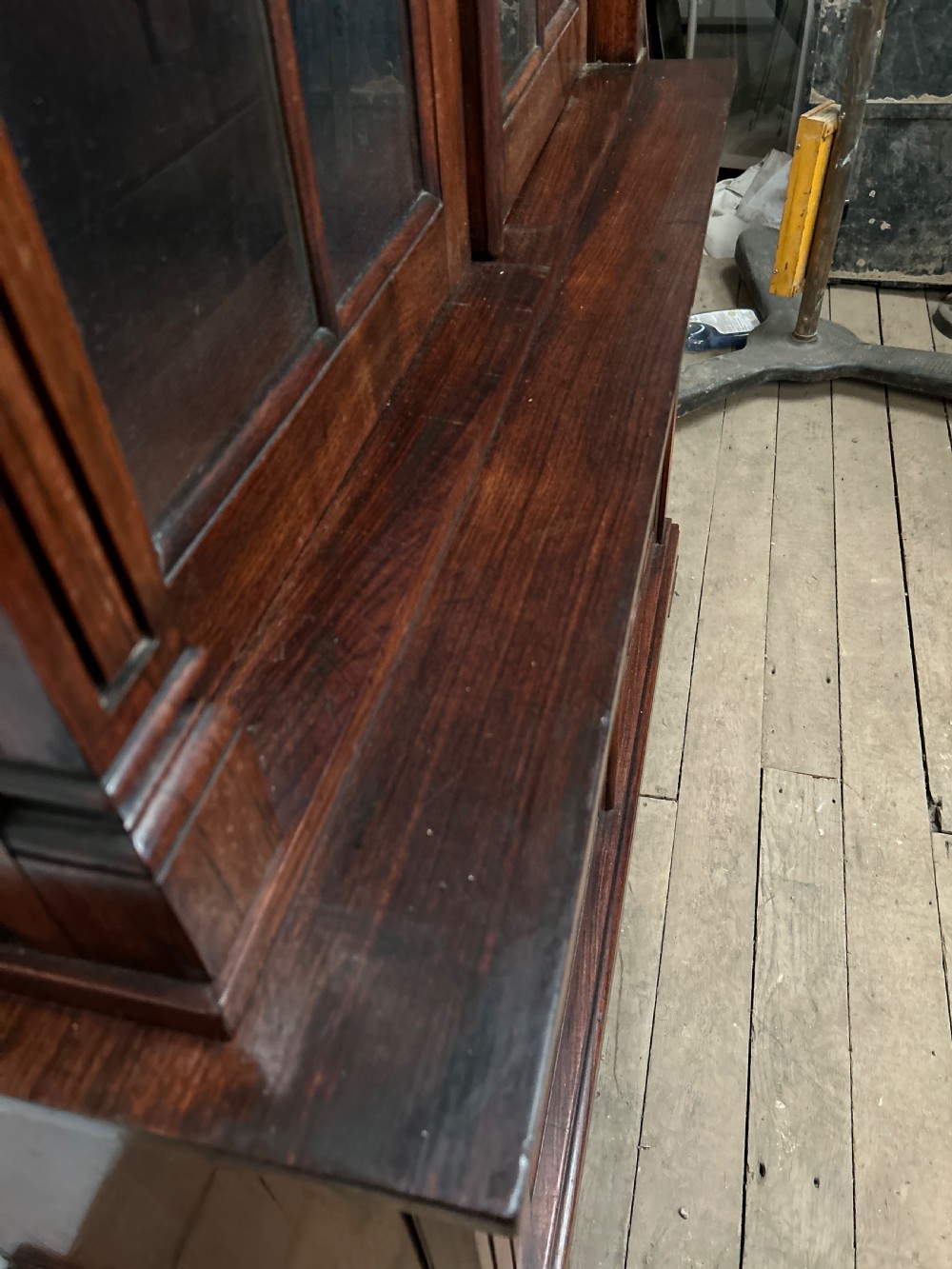 A dark George IV rosewood two-tier bookcase featuring upper glazed doors with Gothic lancet arches and lower panelled doors with tracery. View IX