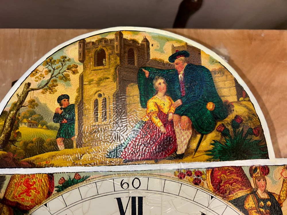 An upright wooden longcase clock featuring a carved swan-neck pediment, a painted dial face, spiral barley twist columns, and a rectangular trunk door. View XIV