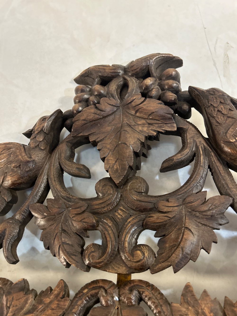An ornate French oak wall mirror featuring intricate hand-carved leaf and grapevine motifs around a rectangular glass plate. View V