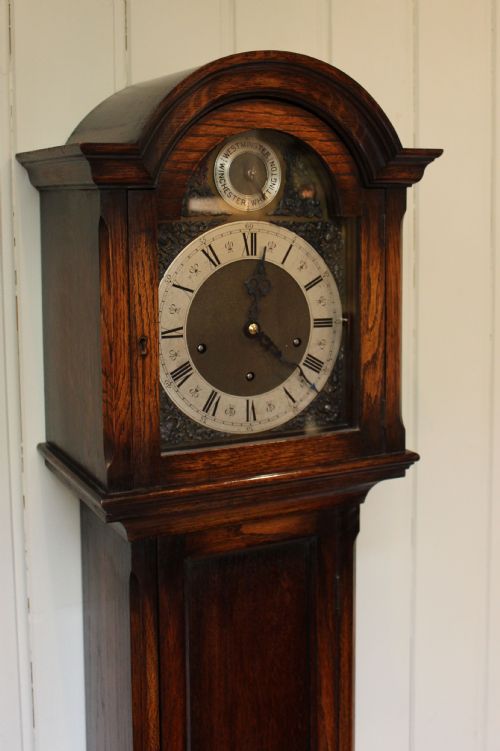 fig 1. Oak Triple Chime Grandmother Clock (England, c. 1920)