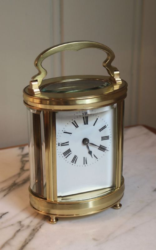 fig 1. Late 19th Century Oval Brass Carriage Clock (France, c. 1890)