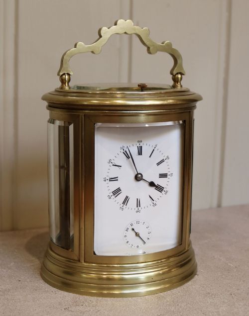 fig 1. French Oval Strike, Repeat and Alarm Carriage Clock (France, 1860)