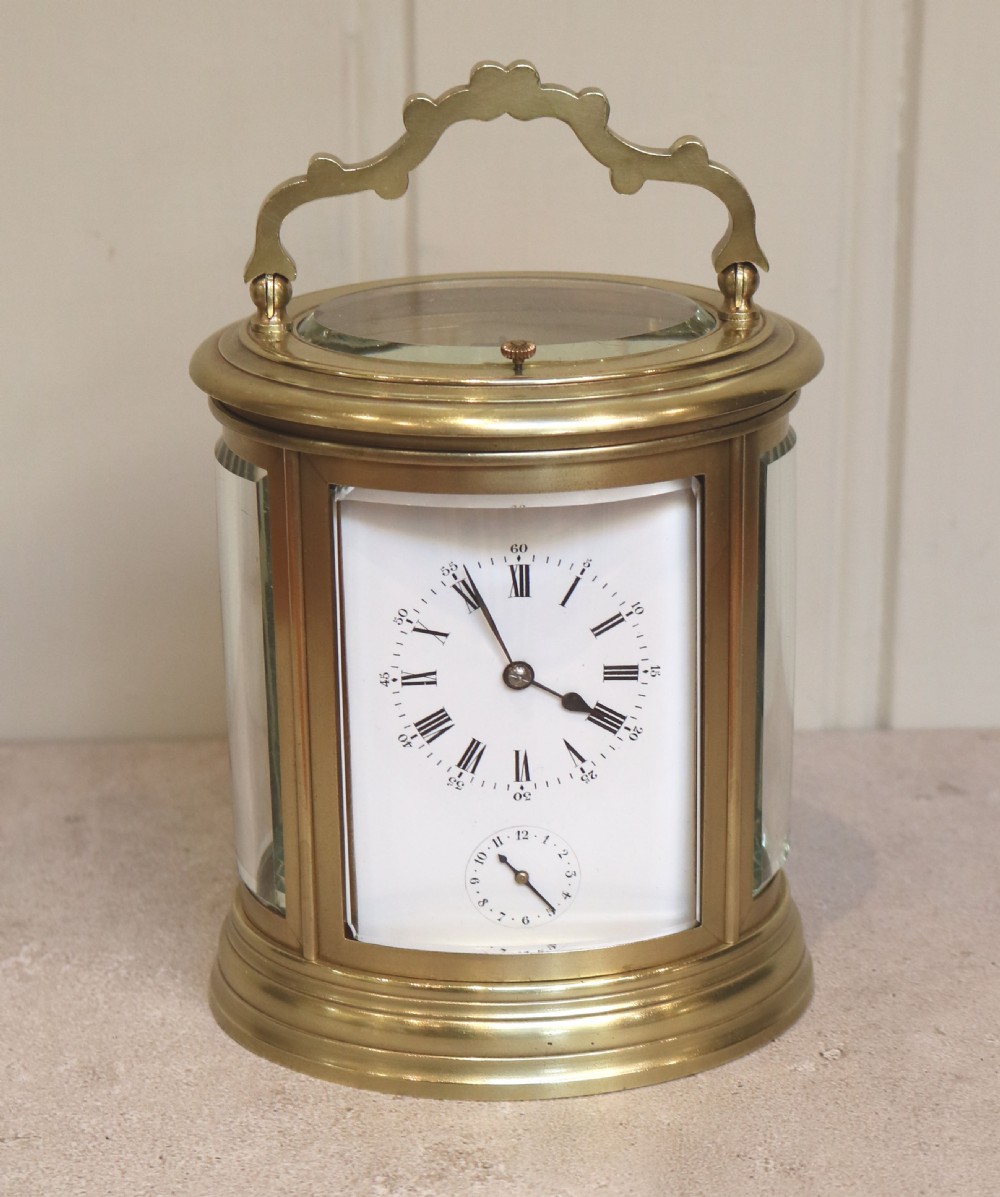 French Oval Strike, Repeat and Alarm Carriage Clock (France, 1860)