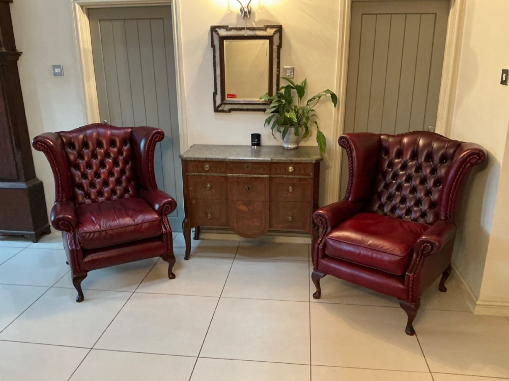 Superb pair of red leather wing arm chairs View II