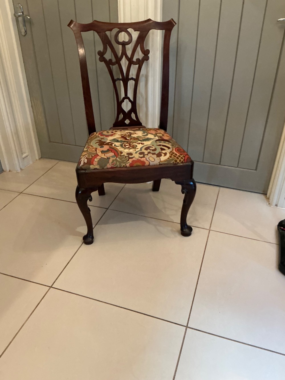 A Georgian mahogany side chair featuring a carved pierced splat back, cabriole front legs, and a needlepoint drop-in seat with a bird pattern. View II