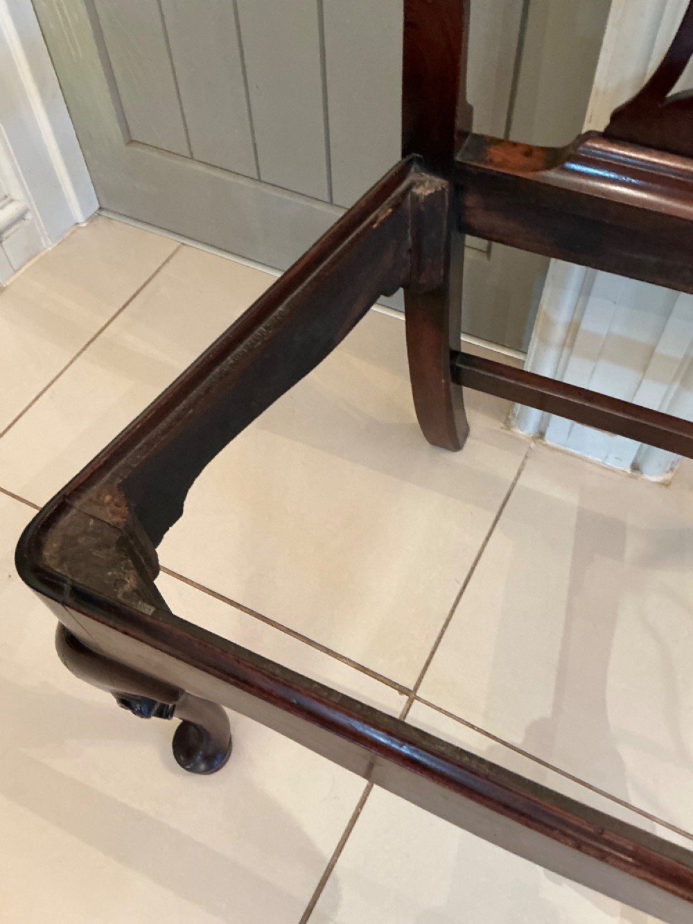 A Georgian mahogany side chair featuring a carved pierced splat back, cabriole front legs, and a needlepoint drop-in seat with a bird pattern. View X