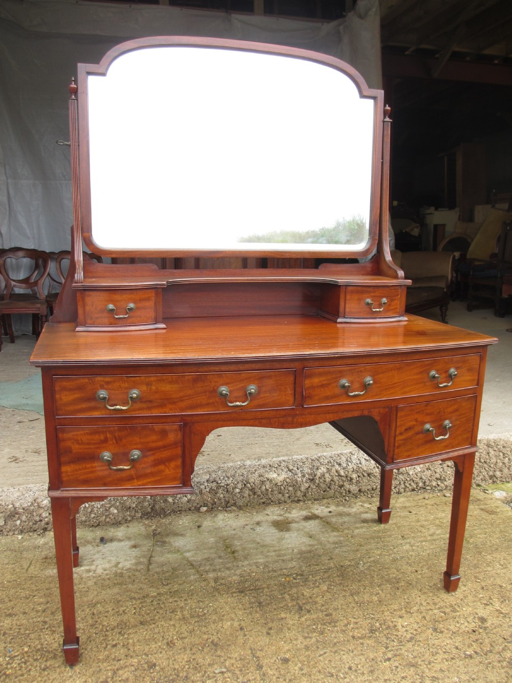Edwardian mahogany bow front dressing table with large bevel mirror