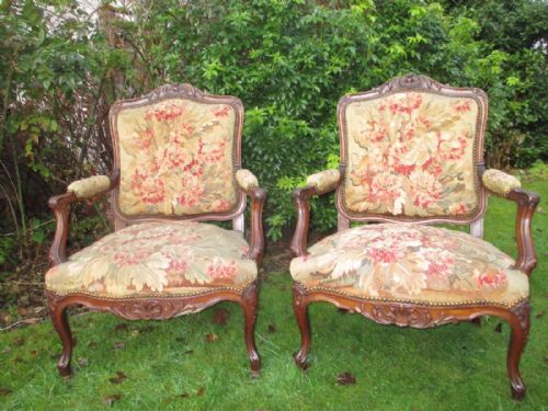 Pair of French Carved Walnut Needlepoint Armchairs