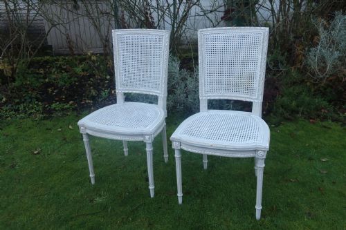 A Pair of French Painted Cane Side Chairs