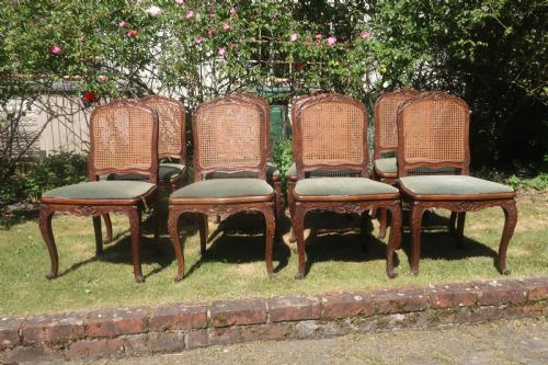 Set of Eight Carved Walnut Dining Chairs