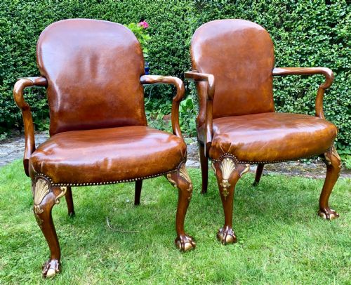 A Pair of Leather and Gilt Armchairs