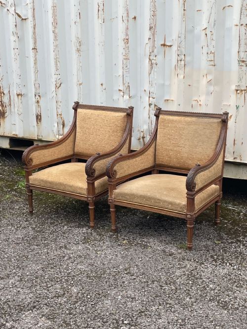 A Pair of Carved Walnut Armchairs