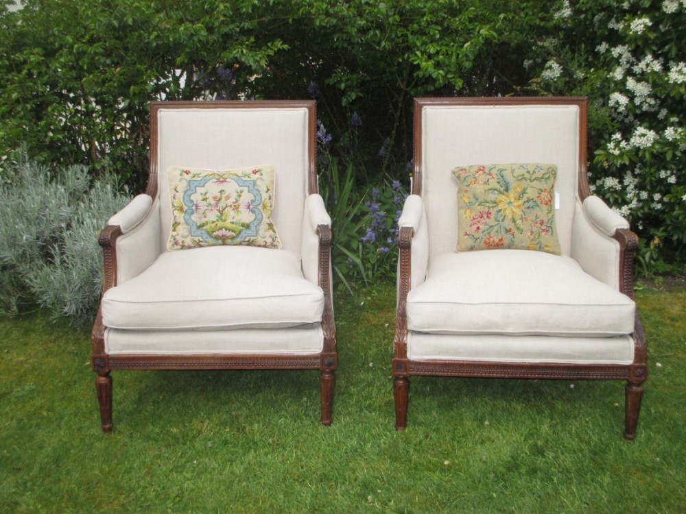 Pair of large walnut armchairs 