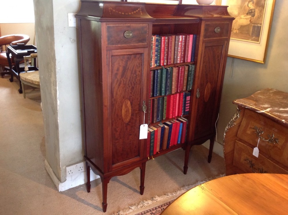 mahogany inlaid bookcase spade feet and marquetry inlay